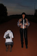TRANSPARENT PVC CROPPED JACKET WITH A HIGH COLLAR, WHITE FRONT ZIP, ADJUSTABLE DRAWSTRINGS, RELAXED FIT AND CLEAR VINYL CONSTRUCTION.
