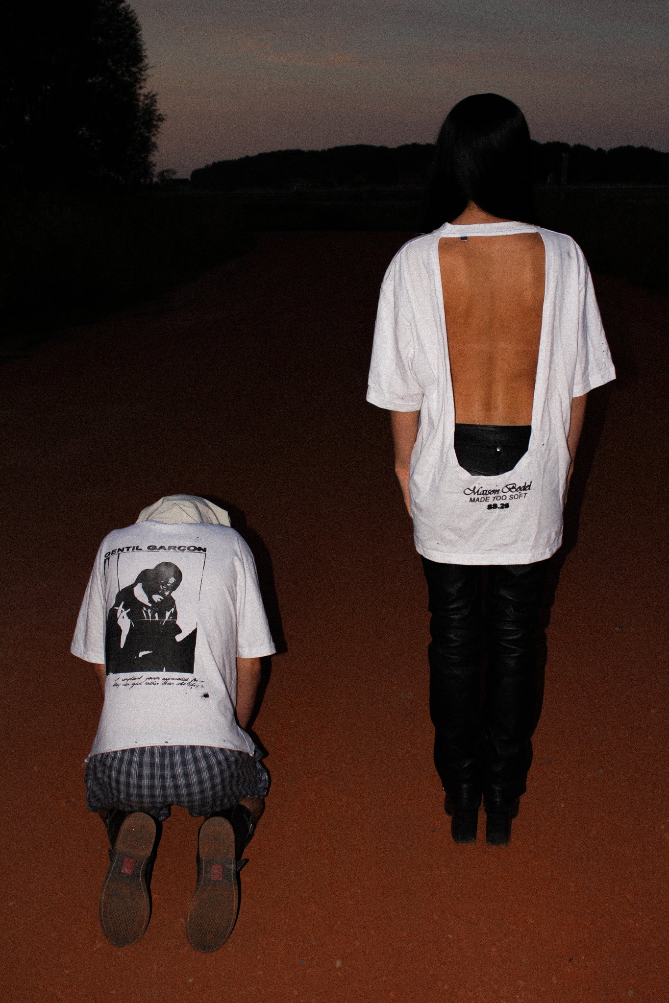 WHITE OVERSIZED T-SHIRT WITH A DEEP OPEN BACK, DISTRESSED DETAILS AND A MAISON BODEL “MADE TOO SOFT” GRAPHIC PRINT ON THE LOWER BACK.