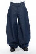 RAW INDIGO OVERSIZED CURVED-LEG JEANS WITH A LOW-RISE WAIST, FIVE-POCKET CONSTRUCTION, BUTTON FLY, SILVER HARDWARE AND A RELAXED SILHOUETTE.
