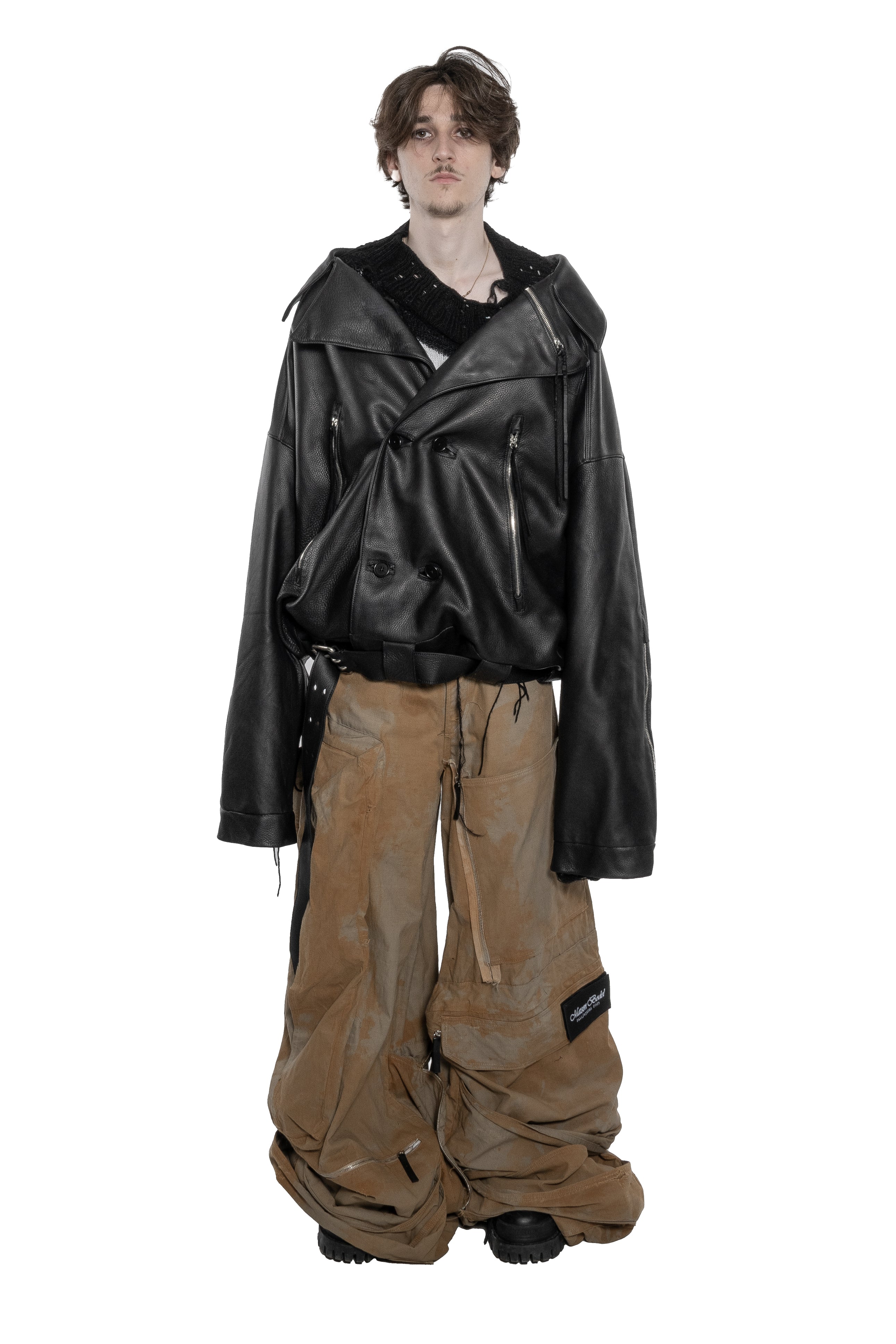BLACK OVERSIZED LEATHER BIKER JACKET WITH DOUBLE-BREASTED CLOSURE, ASYMMETRICAL LAPELS, MULTIPLE ZIPPED POCKETS, ADJUSTABLE WAIST BELT AND SILVER HARDWARE.